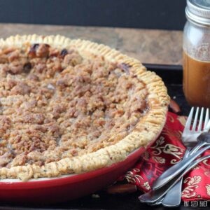 Homemade Dutch Apple Pie just like grandma used to make. Baked in a walnut crust and served with caramel.