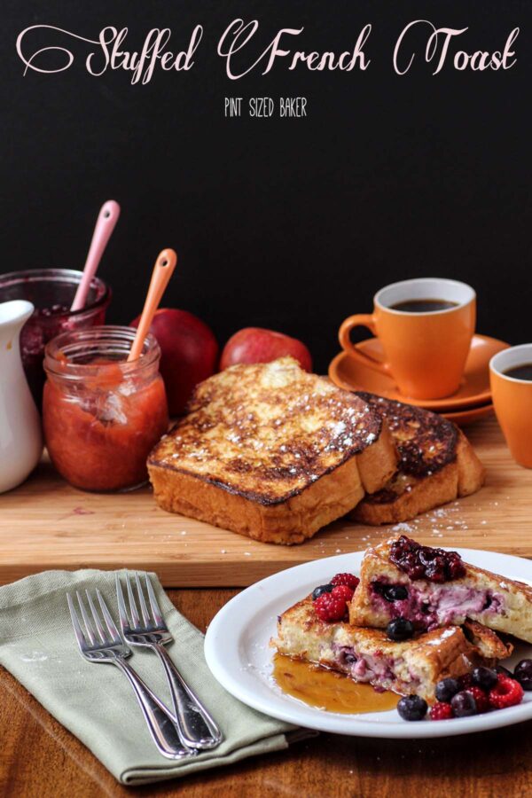 Image showing the stuffed French Toast with homemade jam, cups of espresso, and fresh fruit.