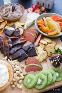 Fresh fruit, chocolate, animal crackers, and whipped cream make up a great dessert charcuterie plate.