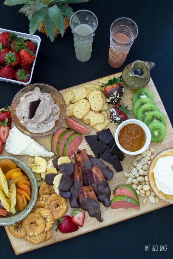 Add a little bit of everything to this dessert charcuterie plate. A mix of cookies, fruit, nuts, chocolate and cheese. Perfect!