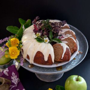Slices of Apple Spice Bundt Cake are calling to be baked this fall season.