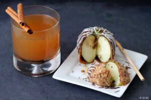 Cut into this Chocolate Covered Caramel Apple while sipping on some hot mulled cider.