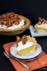Thanksgiving Pumpkin Pie made with real, homemade pumpkin puree and topped with whipped cream and toffee shards.