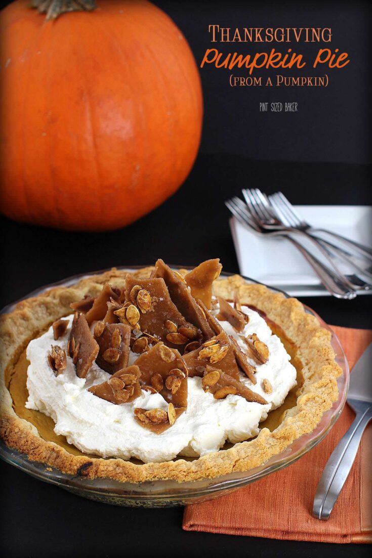 Thanksgiving Pumpkin Pie made with real, homemade pumpkin puree and topped with whipped cream and toffee shards.