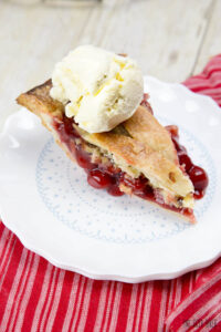 This Cherry Berry Pie is packed full of cherries and raspberries and is great when served with s a scoop of ice cream!