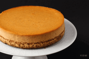 A stunning, delicious, and easy Pumpkin Cheesecake with a ginger snap crust! Perfect!