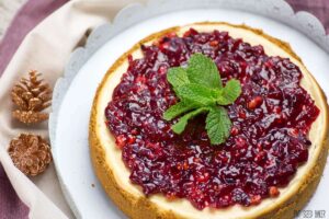 An easy Cheesecake recipe with the best homemade cranberry sauce on top. This Cranberry Cheesecake was the hit of my party!