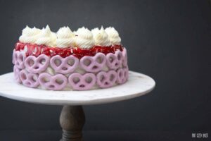 Sweet and Salty desserts are amazing! Sweet White Chocolate Raspberry Cake decorated with salty raspberry pretzels. YUM!