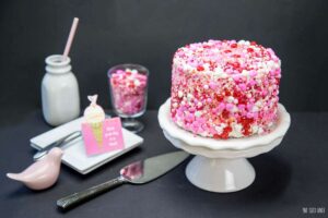 Your favorite Strawberry Cake and Vanilla Frosting all rolled in sprinkles. I'll show you just how easy this technique is to do!