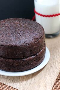 Simple yet decadent Chocolate Cake Recipe that is the perfect base for many different buttercream frostings. Makes two 9" cakes that are great for stacking.