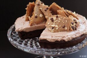 This gluten free chocolate flourless cake is a dense and rich cake covered in whipped cream and topped with mocha meringue bark. 