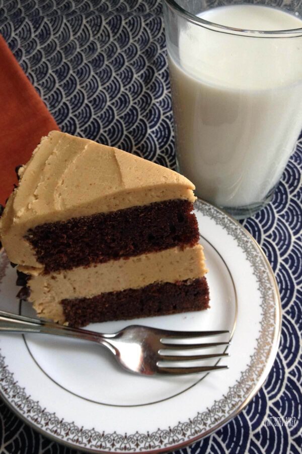 Chocolate Peanut Butter Cake with a chocolate layer cake and a center of peanut butter cookie dough and topped with peanut butter frosting.