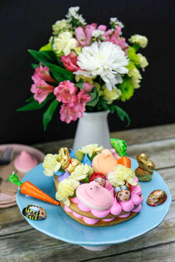 Swap out the Easter basket for a Giant Easter Cookie this year. It's a simple sugar cookie loaded up with frosting and fun Easter candy for the kids to enjoy. 