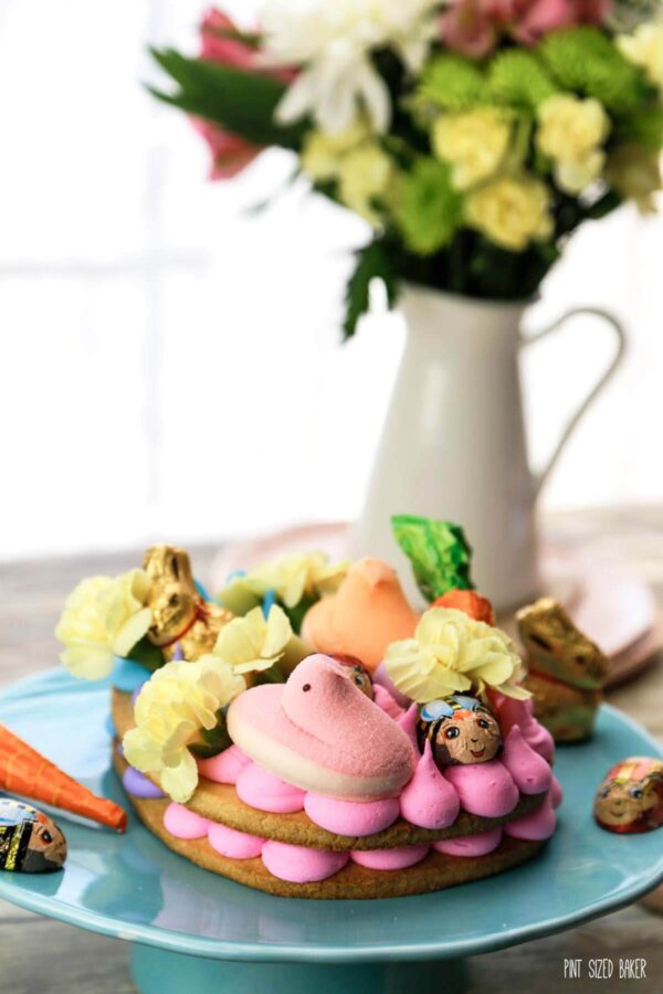 Swap out the Easter basket for a Giant Easter Cookie this year. It's a simple sugar cookie loaded up with frosting and fun Easter candy for the kids to enjoy. 