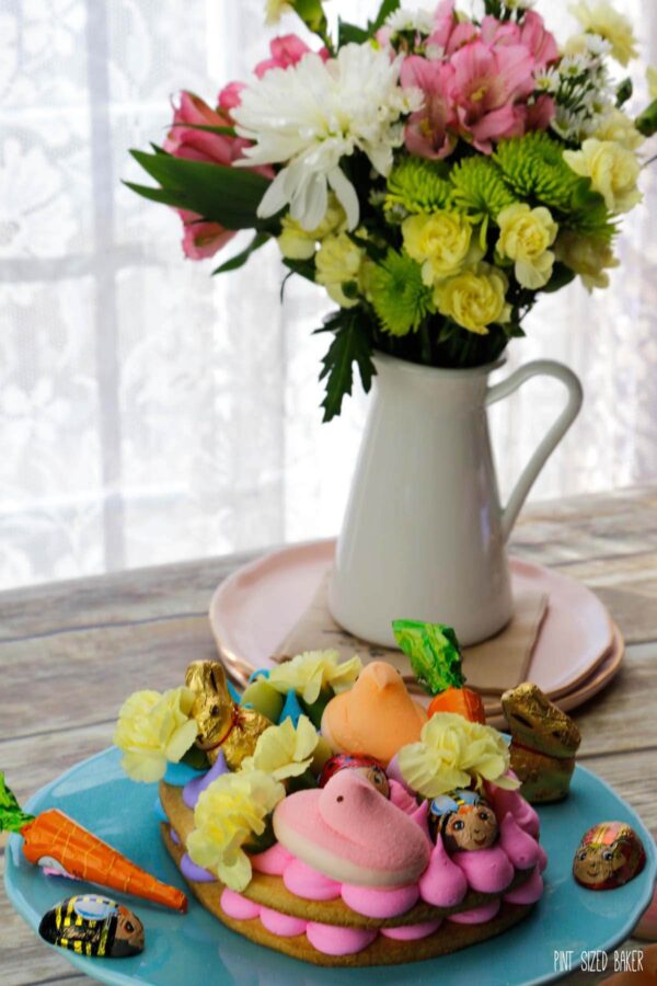 Swap out the Easter basket for a Giant Easter Cookie this year. It's a simple sugar cookie loaded up with frosting and fun Easter candy for the kids to enjoy. 