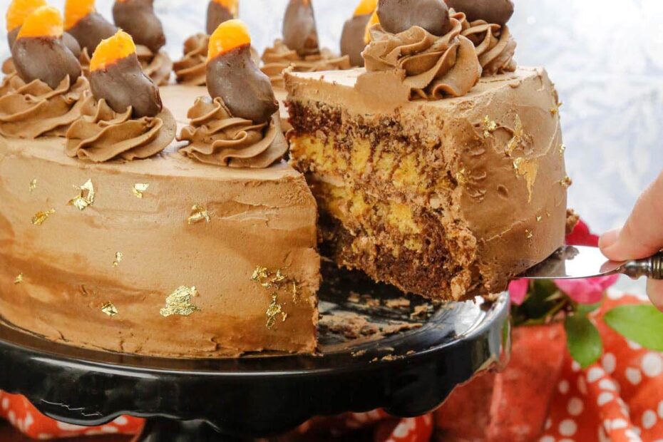 This amazing Orange and Chocolate Cake is totally vegan and the inside and looks amazing when sliced into. Cover it in ganache or make a vegan frosting.