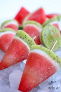 Closeup of watermelon pops on a bed of ice.