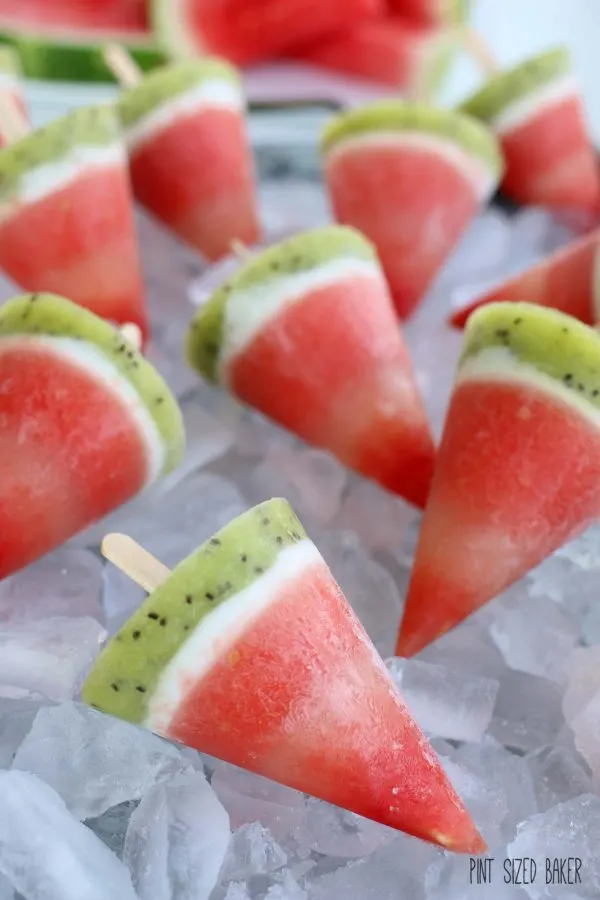 Boozy watermelon pops for summer party on a bed of ice.