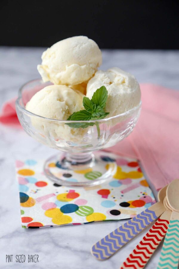 Three scoops of Classic Vanilla Ice Cream in a glass bowl