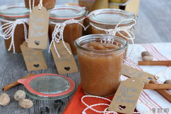 Close up view of an Apple Butter that was made in a crockpot and is stored in glass jars.