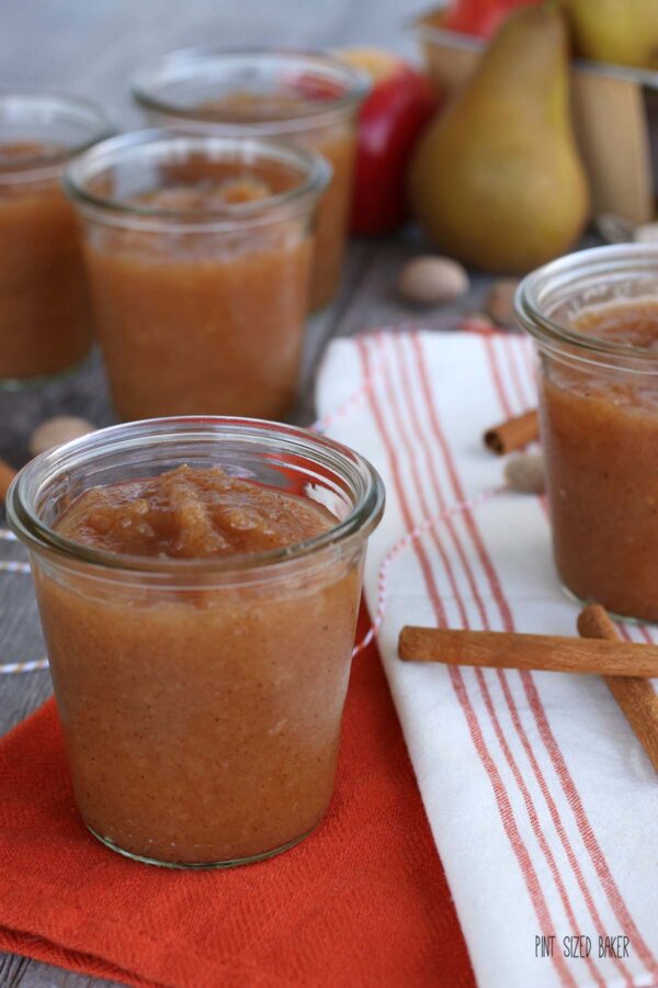 Close up view of a Pear and Apple Butter Recipe stored in glass jars.