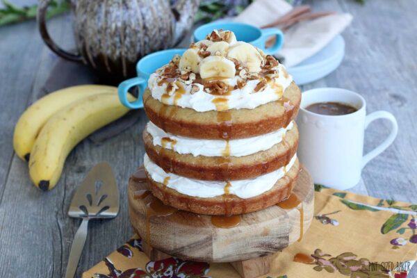 Horizontal image of finished banana cake. This naked cake is caramel sauce covered and delicious! 