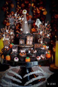 an image of a Haunted house cupcake tower decorated for Halloween