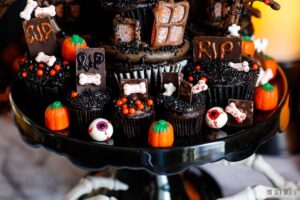 Candy pumpkins and gummy eyeballs with mini cupcakes for Halloween