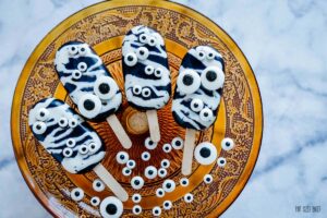 Cakesickles filled with caramel and chocolate cake and decorated up for Halloween! These are easier than you think to make!