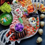 A Halloween Candy Ghost Charcuterie Board covered in fun Halloween treats.