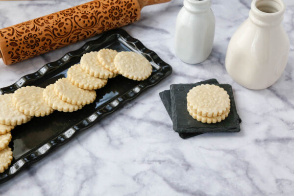 A horizontal image of the shortbread cookies on a black platter 