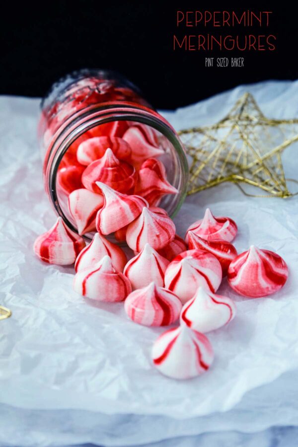 Lead-in image of red and white peppermint meringue cookies pouring out of a jar.