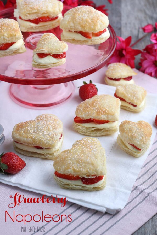 Heart shaped Strawberry Napoleons ready to serve on a pink platter.