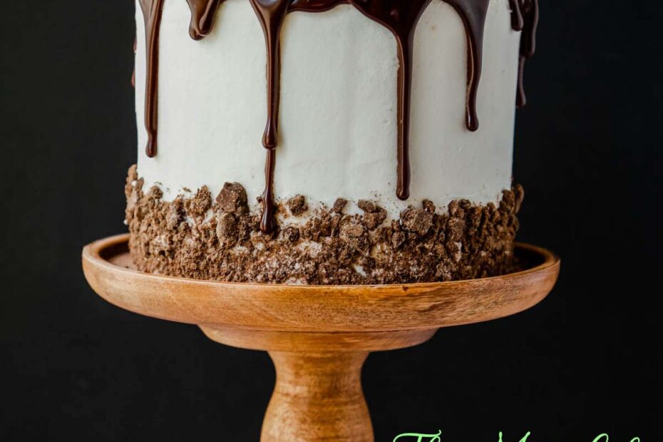 A Thin Mint Cookie Cake on a wooden cake pedestal.