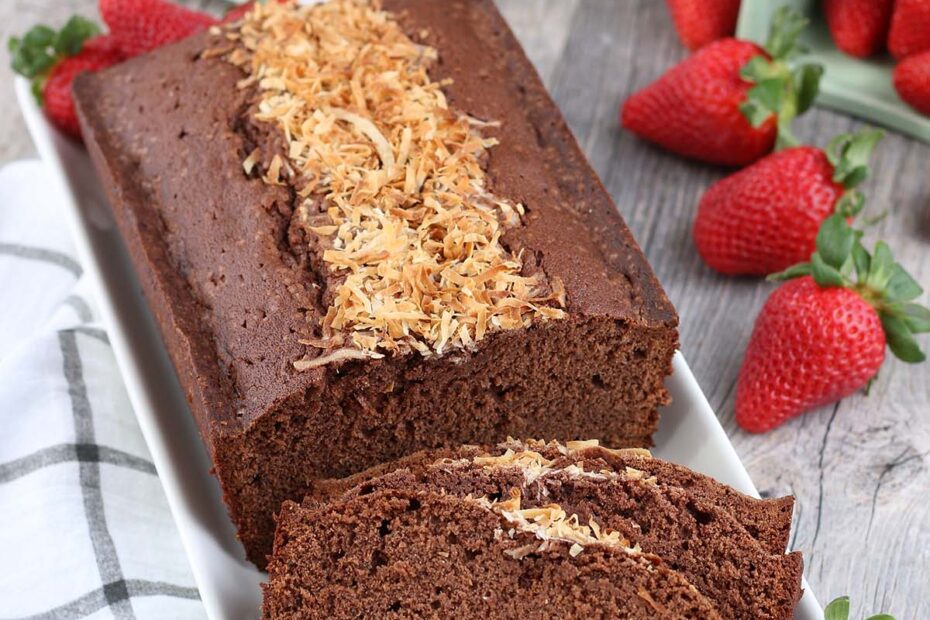 Simply the best chocolate pound cake recipe that's made even better with a tunnel of shredded coconut down the middle. We love this easy dessert!
