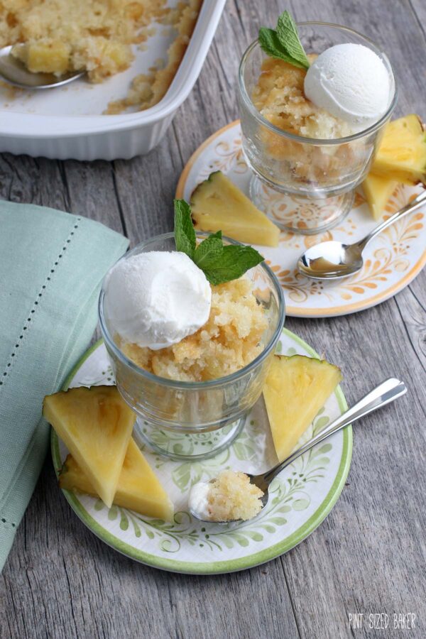 Image of pineapple cobbler being served up and ready to eat with a scoop of vanilla ice cream.