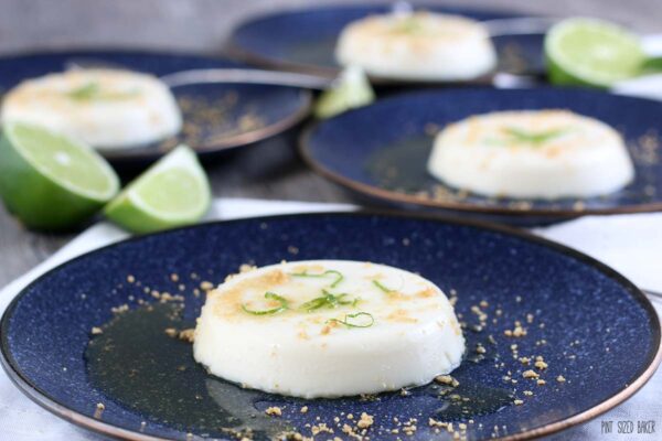 A horizontal view of the finished key lime panna cotta recipe on a plate ready to eat. 