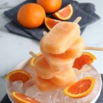 The introductory image of the Orange Juice and Campari Popsicles.