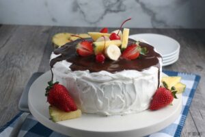 A horizontal image showing the recipe for banana split cake finished and ready to be devoured.