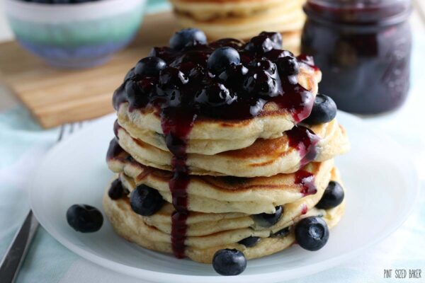 A horizontal image of the fresh blueberry pancakes ready to be eaten.