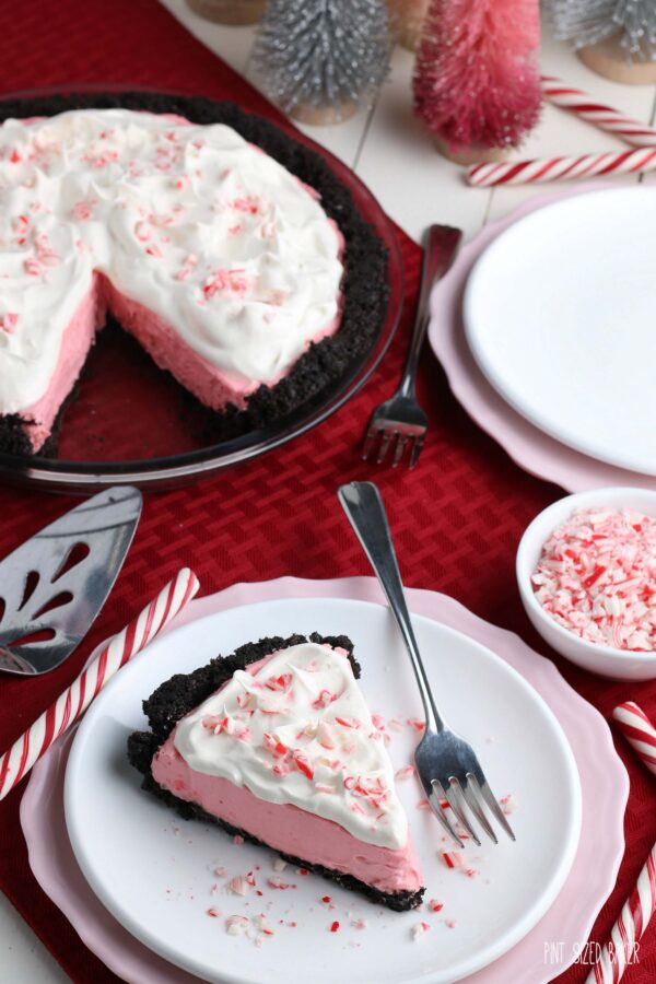 Photo of the pink pie with whipped cream and candy cane bits. 