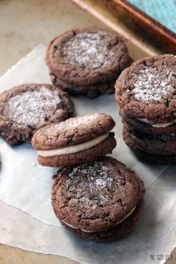 A bunch of chocolate sandwich cookies on a platter.