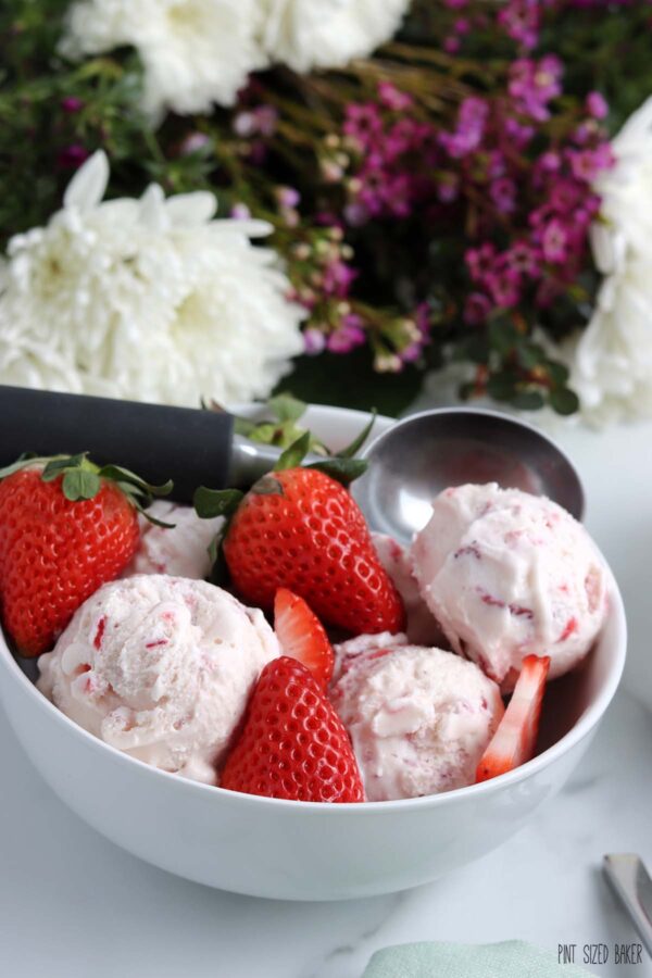 Up close image of the homemade ice cream with fresh sliced strawberries.