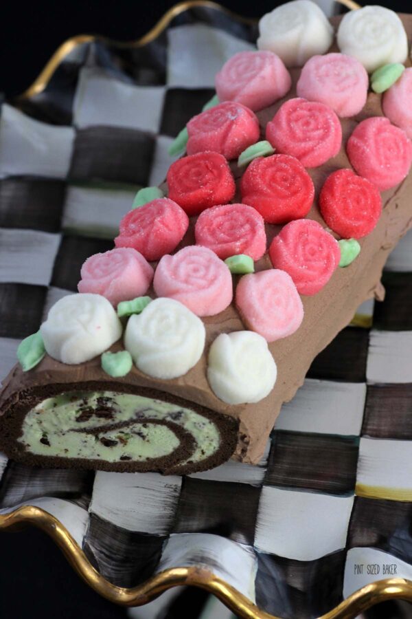 An image showing the ombre look of the cream cheese mint candies I used to decorate the roll cake.
