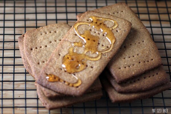 Homemade graham crackers served with a drizzle of honey.