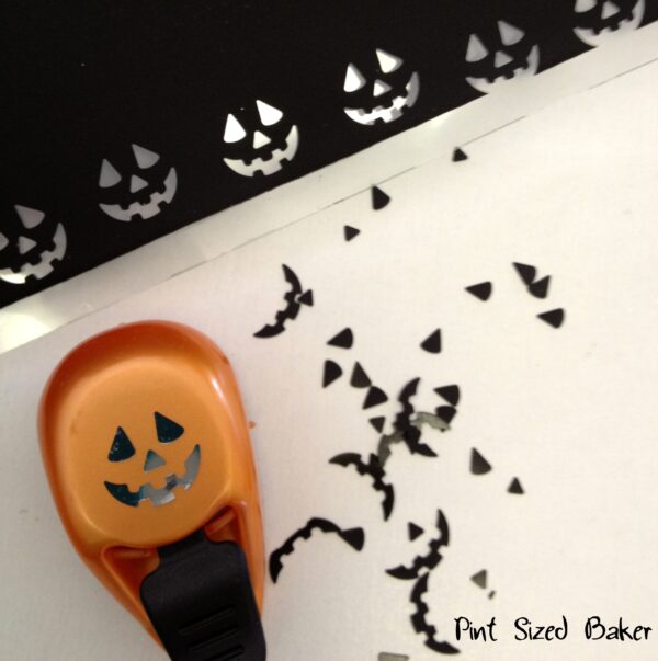 Use a Jack-o-Lantern hold punch to make the candy face for your cake pops.