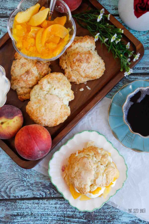 Overhead image of the biscuits, peaches, and finished shortcake on a plate.