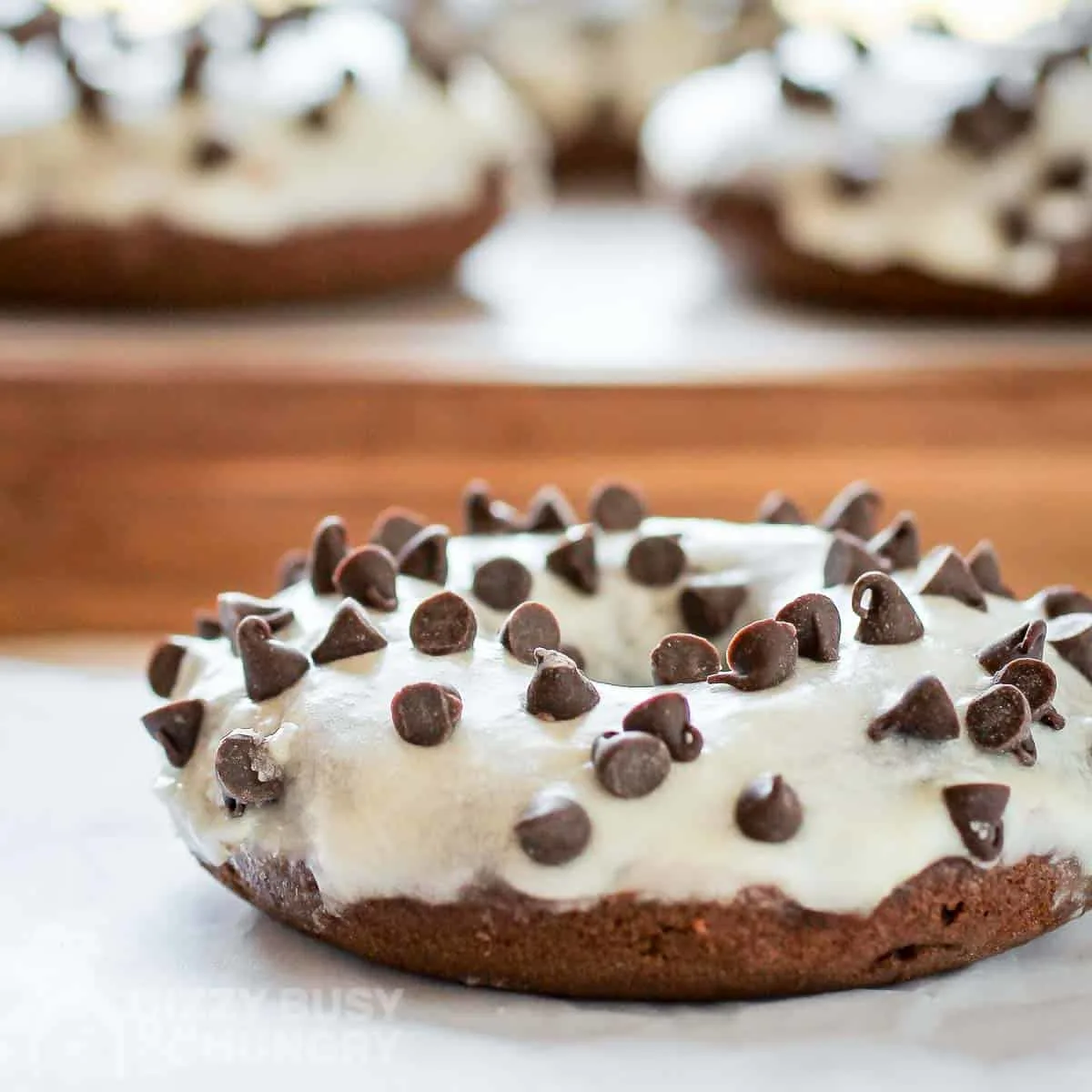 baked chocolate doughnuts with orange glaze feature
