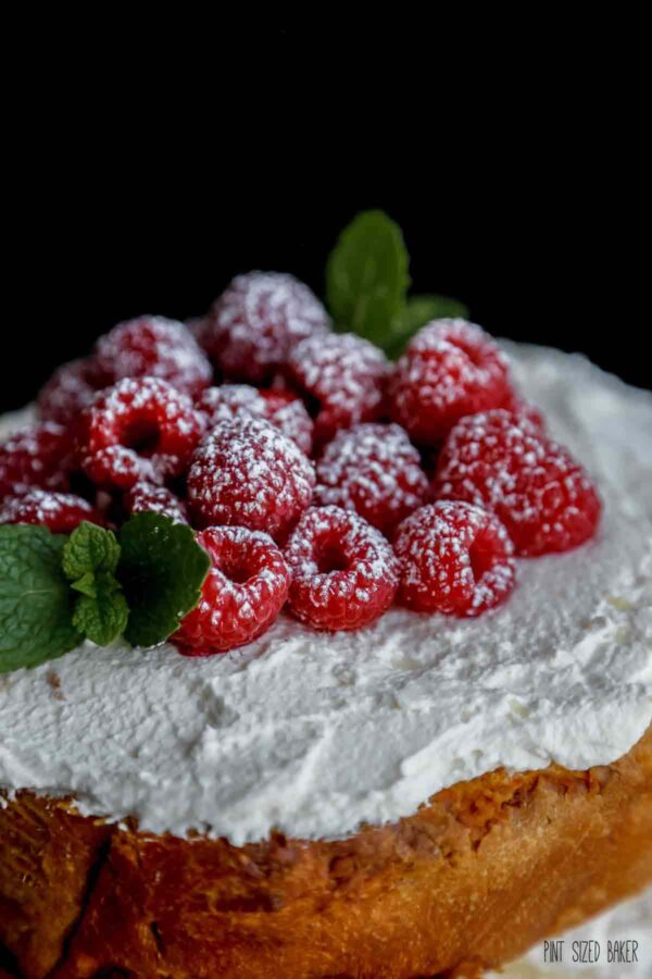 Up close view of the sugar coated raspberries on top of the cake.