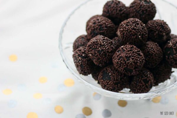 Chocolate Truffles rolled in chocolate jimmies in a glass bowl.